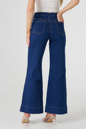 A model wearing the Katie Highin colourWaisted Front Pocket Wide Leg Jean - Indigoden (Blue), from the back