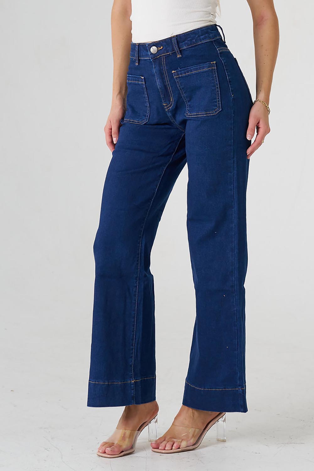 A model wearing the Katie Highin colourWaisted Front Pocket Wide Leg Jean - Indigoden (Blue), from the front, cropped image