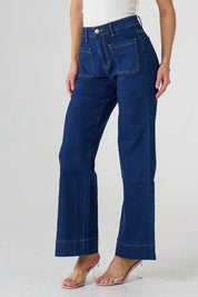 A model wearing the Katie Highin colourWaisted Front Pocket Wide Leg Jean - Indigoden (Blue), from the front, cropped image