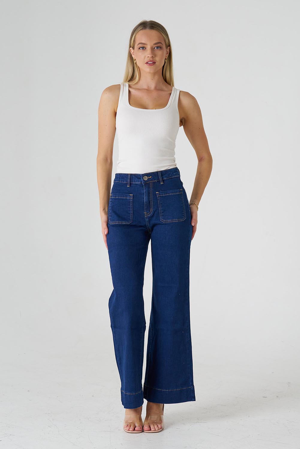 A model wearing the Katie Highin colourWaisted Front Pocket Wide Leg Jean - Indigoden (Blue), from the front, showing the whole outfit
