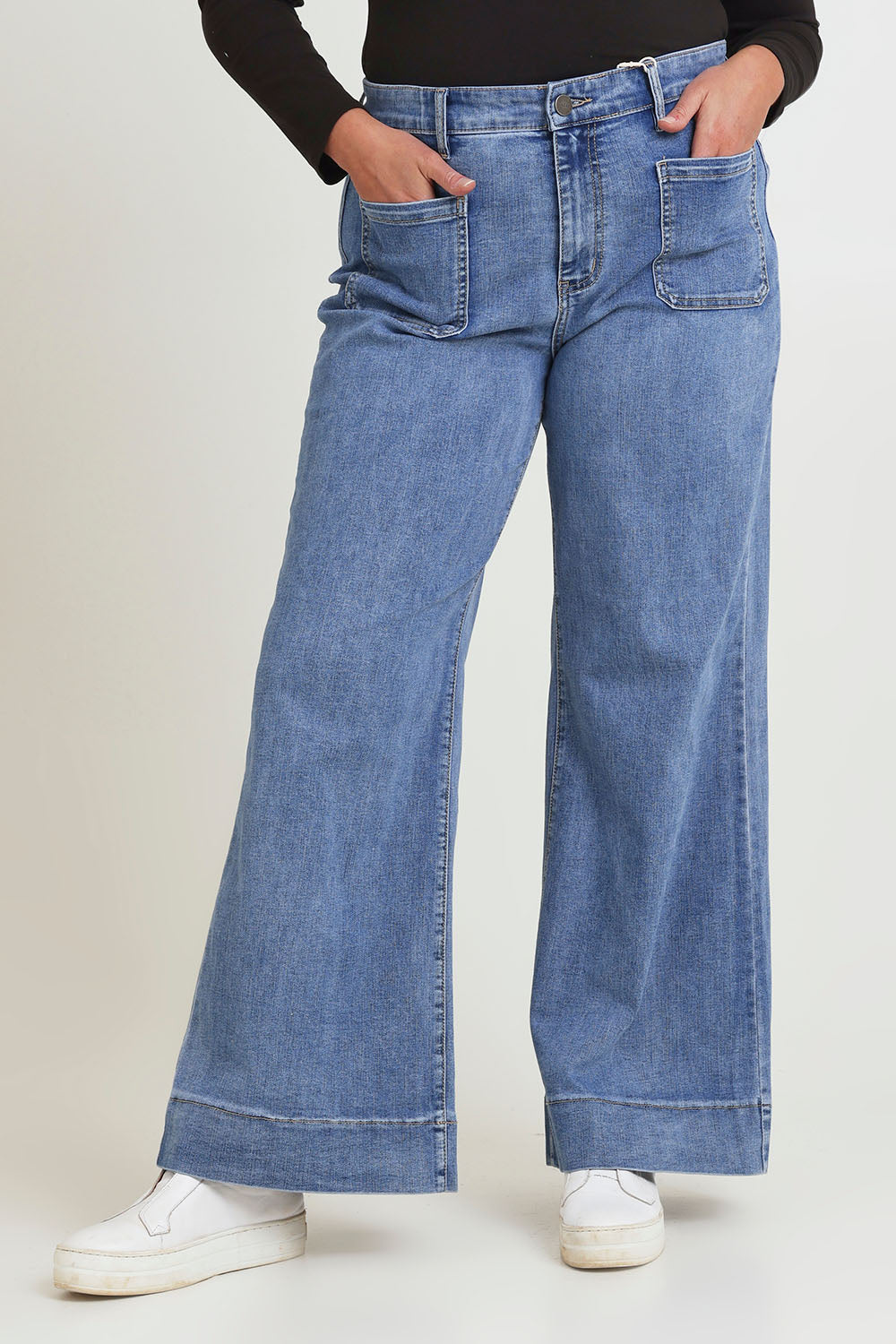 Model Chanel wearing size 16 of the Katie Highin colourWaisted Front Pocket Wide Leg Jean - Lightdenim (Blue), from the front, cropped image