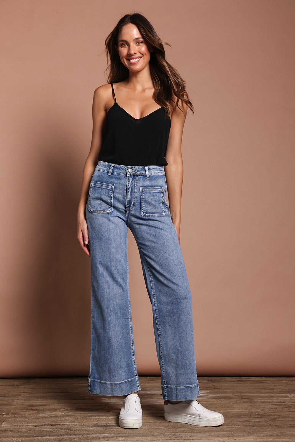 Model Madeline wearing size 9 of the Katie Highin colourWaisted Front Pocket Wide Leg Jean - Lightdenim (Blue), from the front, showing the whole outfit