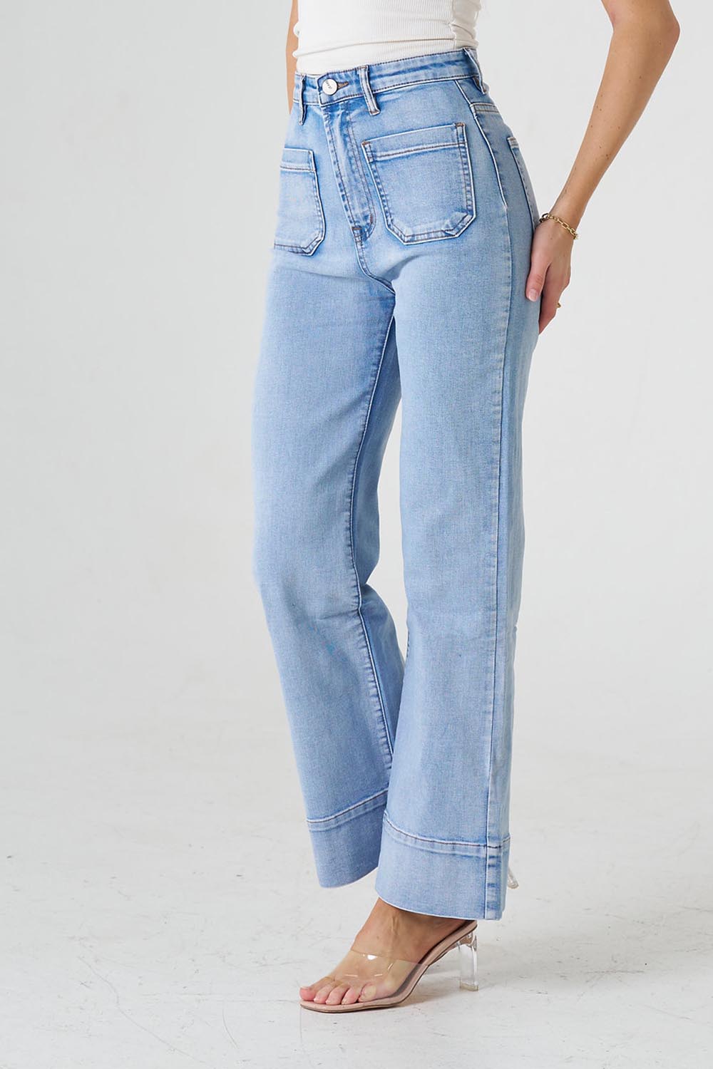 A model wearing the Katie Highin colourWaisted Front Pocket Wide Leg Jean - Paledenim (Blue), from the front, cropped image