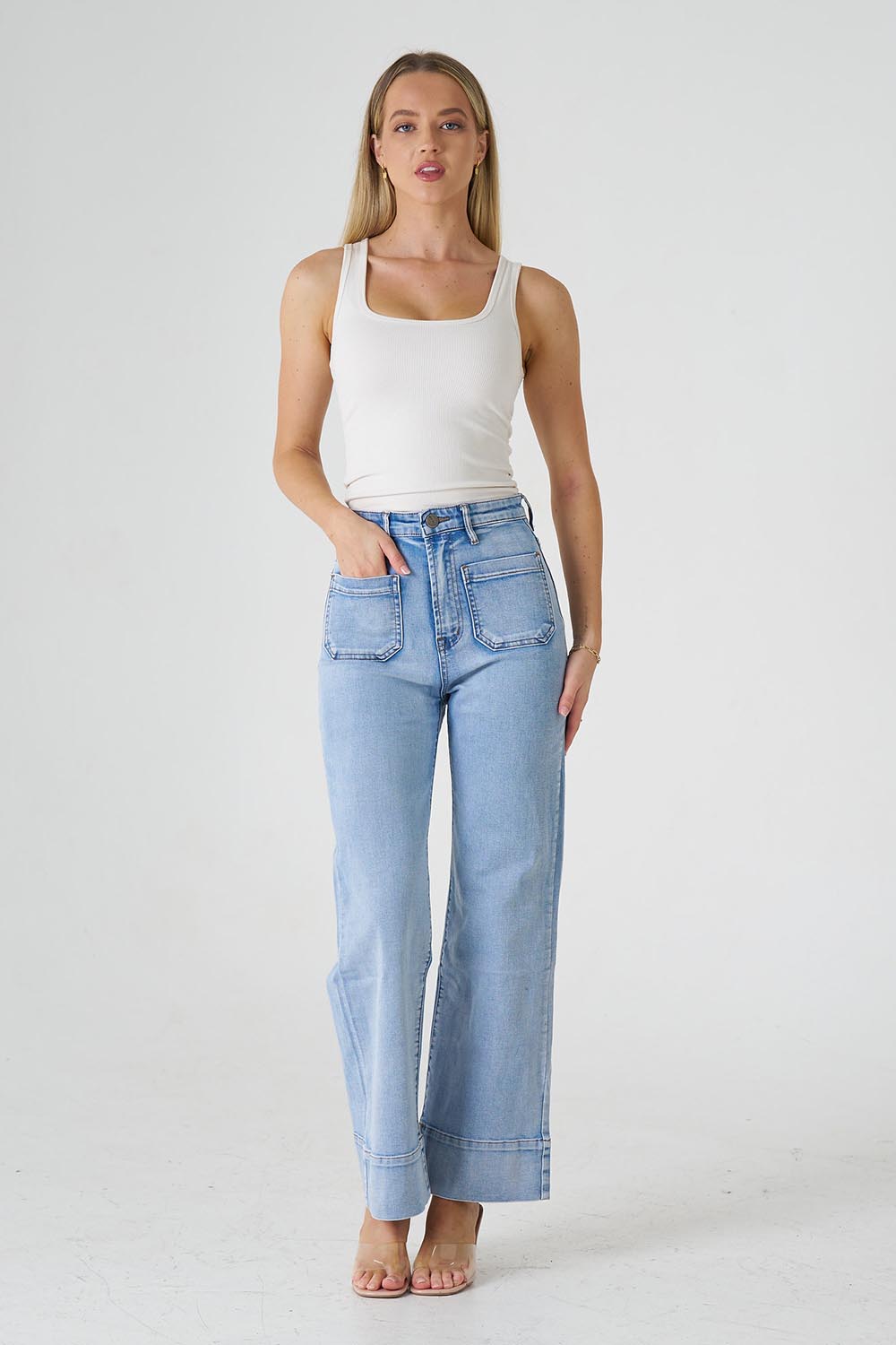 A model wearing the Katie Highin colourWaisted Front Pocket Wide Leg Jean - Paledenim (Blue), from the front, showing the whole outfit