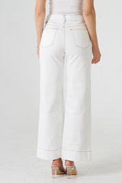 A model wearing the Katie Highin colourWaisted Front Pocket Wide Leg Jean - Whitstitch (White), from the back