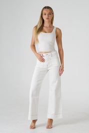 A model wearing the Katie Highin colourWaisted Front Pocket Wide Leg Jean - Whitstitch (White), from the front, showing the whole outfit