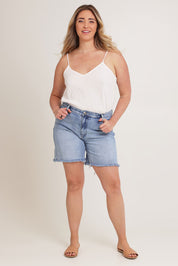 Model Chanel wearing size 16 of the Kerrie Frayed Hem Shorts in colour Lightdenim (Blue), from the front, showing the whole outfit