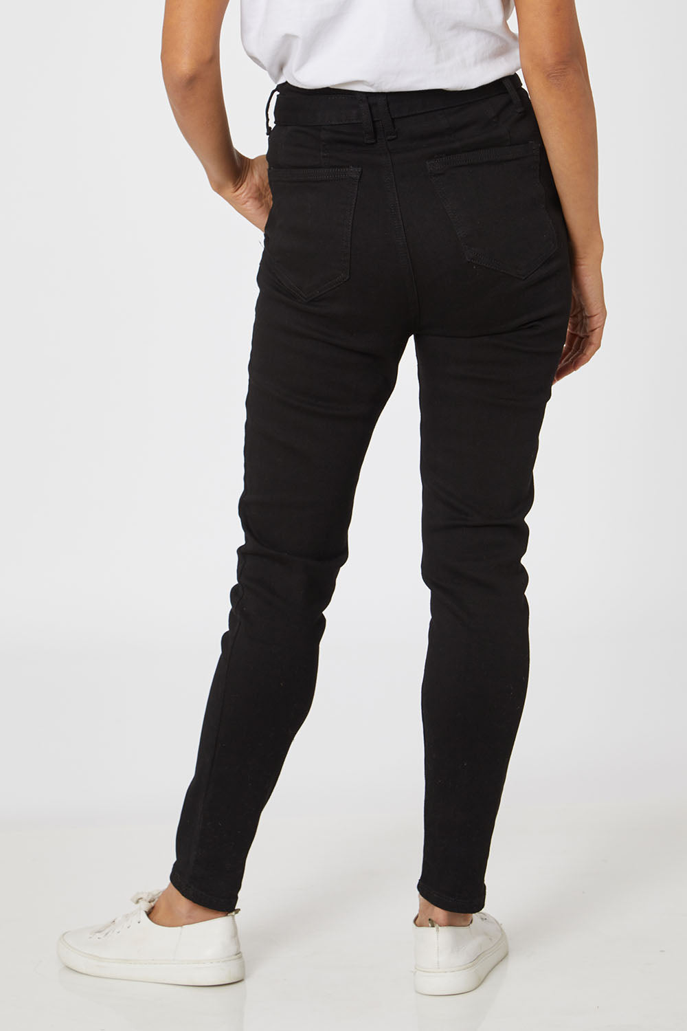 Model Cara wearing size 10 of the Leanne High Rise Tie Waist Jeans in colour Black (Black), from the back