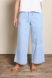 Model Riinar wearing size 10 of the Maya Wide Leg Drawstring Jean - Paledenim in colour Paledenim, from the front