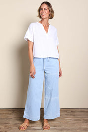 Model Riinar wearing size 10 of the Maya Wide Leg Drawstring Jean - Paledenim in colour Paledenim, from the front