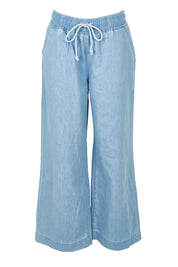 Product shot of the Maya Wide Leg Drawstring Jean in colour Paledenim (Blue), from the front