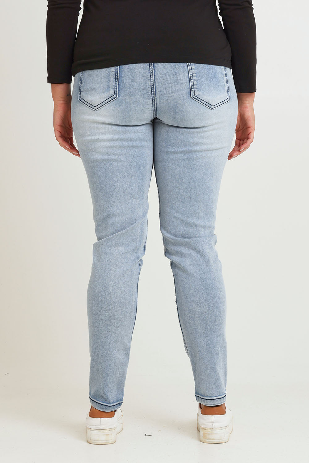 Model Chanel wearing size 16 of the Paige Pull On Jean in colour Lightblue (Blue), from the back