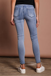Model Madeline wearing size 9 of the Paige Pull On Jean in colour Lightblue (Blue), from the back