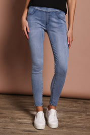 Model Madeline wearing size 9 of the Paige Pull On Jean in colour Lightblue (Blue), from the front, cropped image