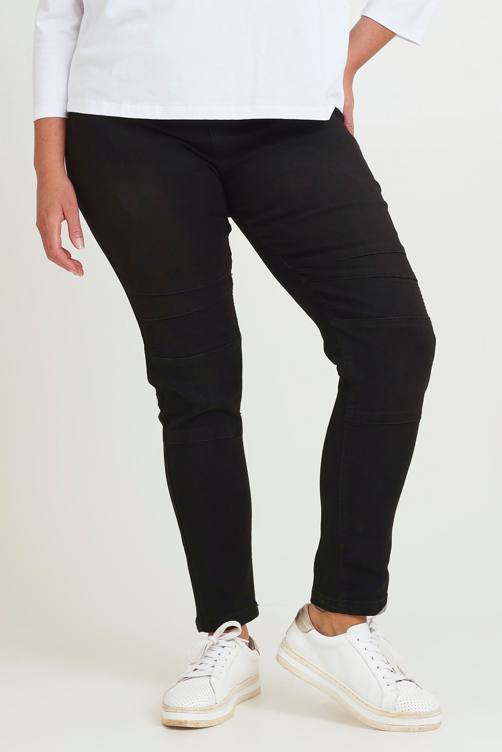 Model Chanel wearing size 16 of the River Ribbed Pull On Jean in colour Black (Black), from the front, cropped image