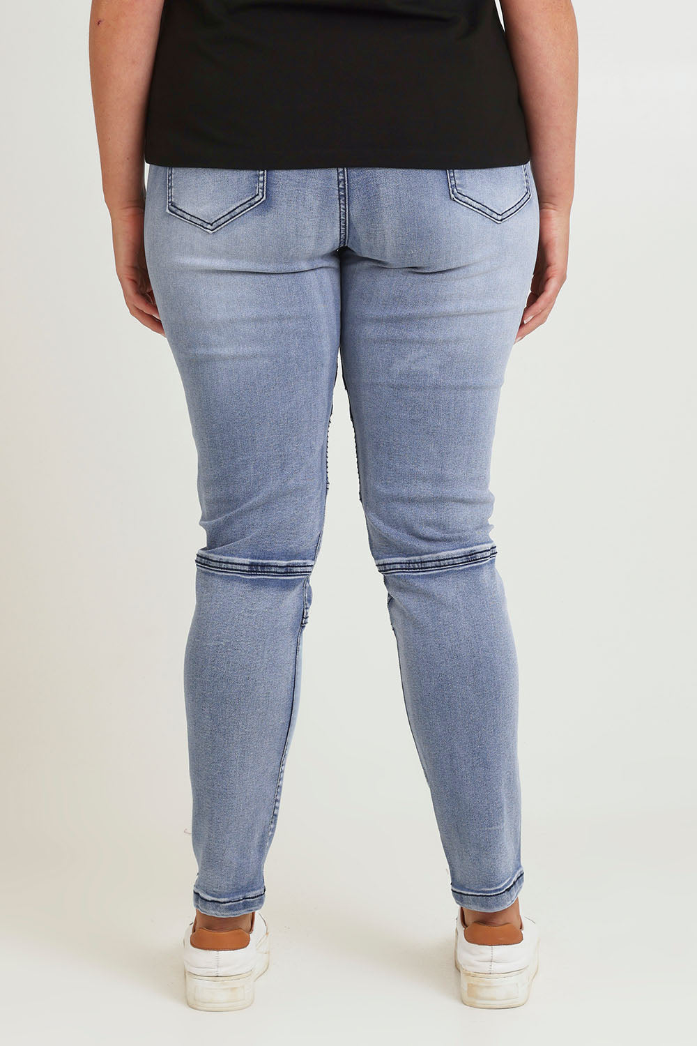 Model Chanel wearing size 16 of the River Ribbed Pull On Jean in colour Lightdenim (Blue), from the back
