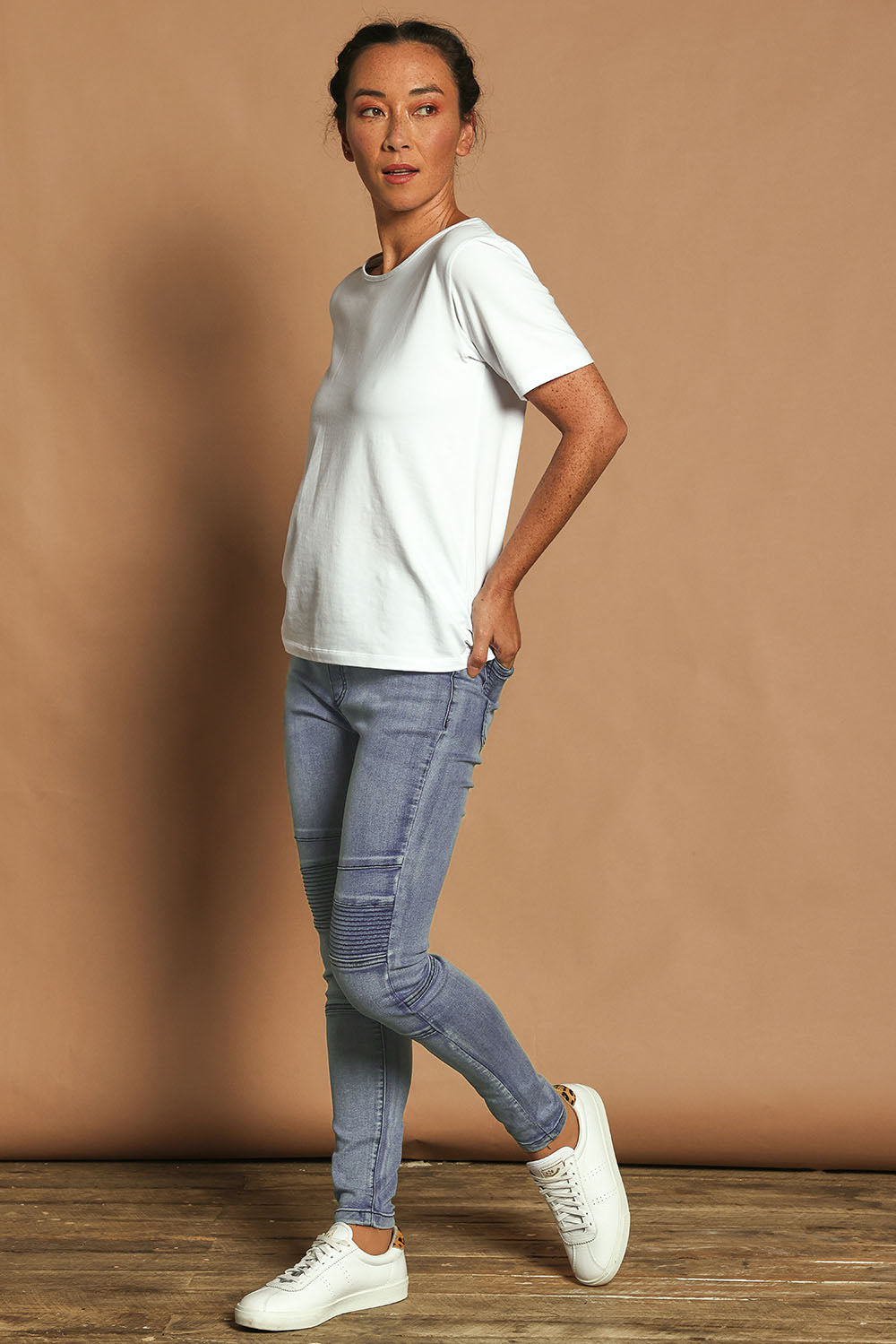 Model Katie wearing size 10 of the River Ribbed Pull On Jean in colour Lightdenim (Blue), from the front, showing the whole outfit