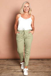 Model Sandy wearing size 10 of the Robin Drawstring Pull On Pant in colour Khaki (Green), from the front, showing the whole outfit