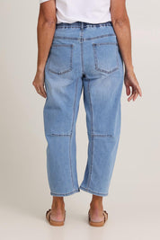 Model Sandy wearing size 10 of the Rubi Pocket Barrel Jean in colour Lightdenim (Blue), from the back