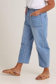 Model Sandy wearing size 10 of the Rubi Pocket Barrel Jean in colour Lightdenim (Blue), from the front, cropped image