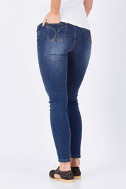 Model Maddy wearing size 10 of the Rey Skinny in colour Denim (Blue), from the back