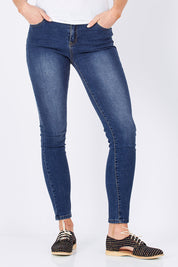 Model Maddy wearing size 10 of the Rey Skinny in colour Denim (Blue), from the front, cropped image