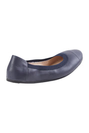 Product shot of the Ava Leather Flat in colour Navy (Blue), from the back