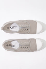 A model wearing size 37 of the Euro Elastic Plimsole in colour Grey (Grey), from the front, showing the whole outfit