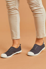 A model wearing size 38 of the Euro Elastic Plimsole in colour Midnight (Blue), from the front, cropped image