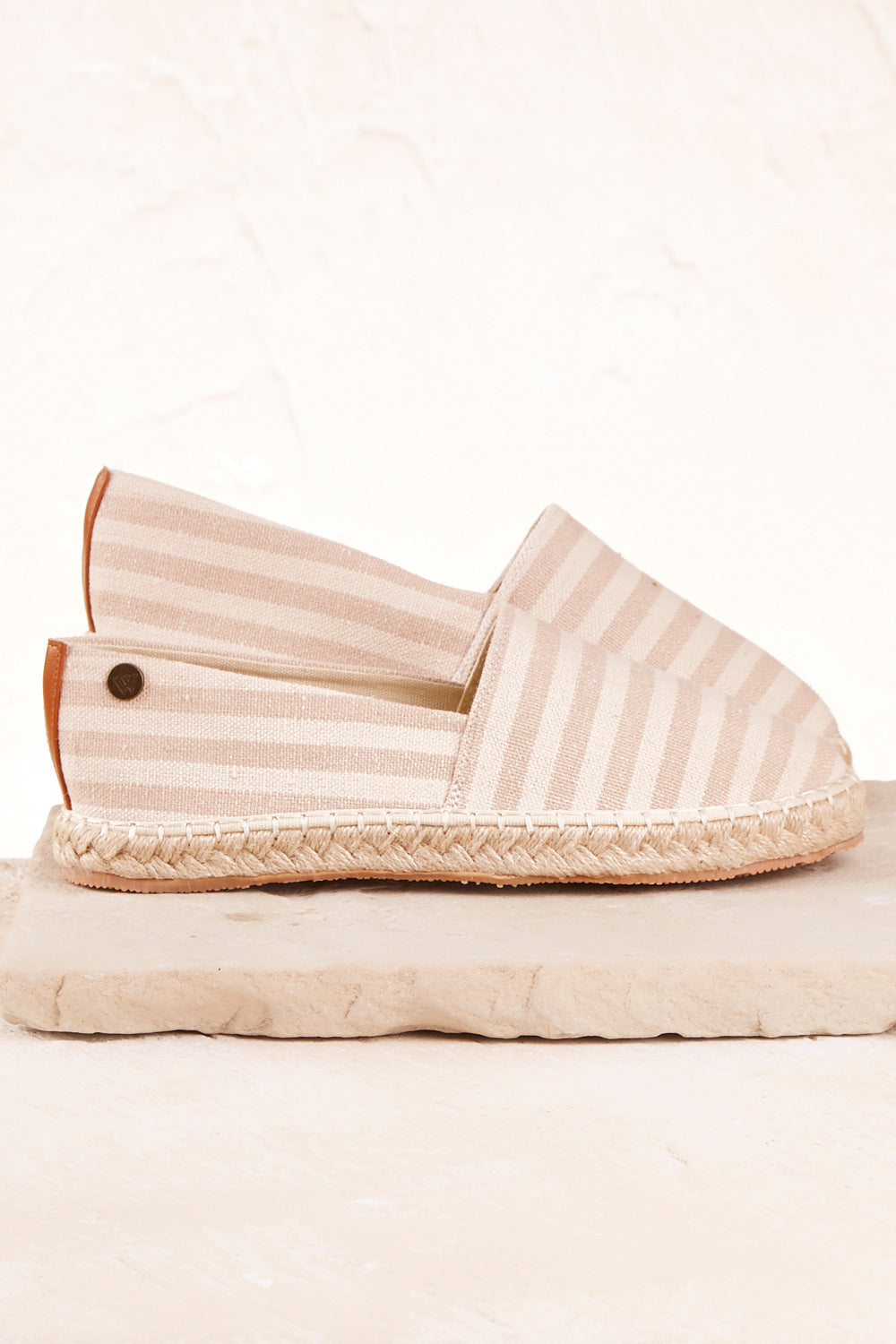 A model wearing size 37 of the Georgie Stripe Espadrille in colour TaupeStri, from the front, showing the whole outfit