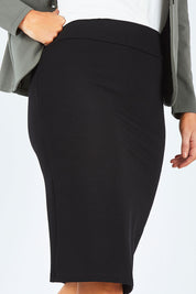 Model Laura wearing size 14 of The Ponte Knee Length Pencil Skirt in colour Black (Black), from the front, cropped image