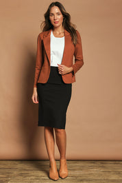 Model Madeline wearing size 10 of The Ponte Knee Length Pencil Skirt in colour Black (Black), from the front, showing the whole outfit