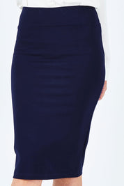 Model Chelsea wearing size 10 of The Ponte Knee Length Pencil Skirt in colour Navy (Blue), from the front, cropped image