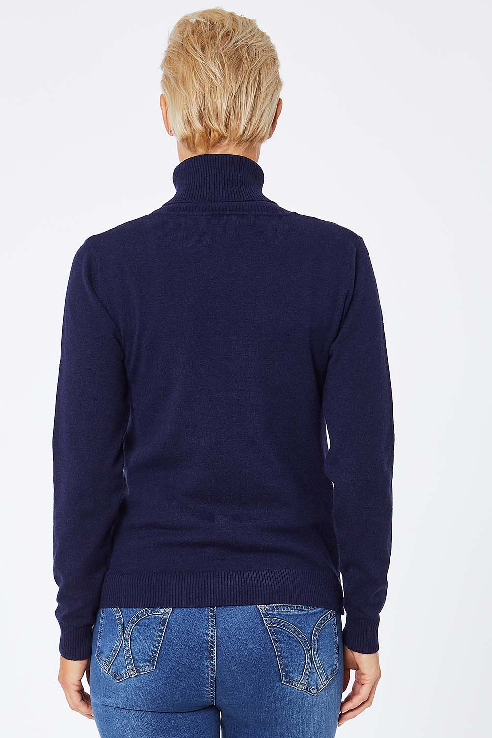 Model Amelia wearing size S of the Turtle Neck Jumper in colour Navy (Blue), from the back