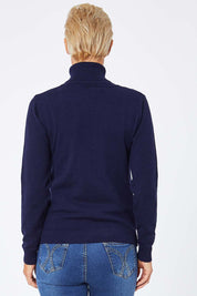 Model Amelia wearing size S of the Turtle Neck Jumper in colour Navy (Blue), from the back
