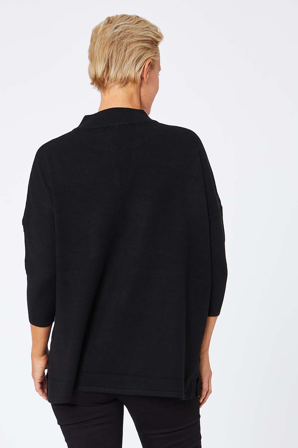 Model Amelia wearing the 3/4 Sleeve Zip Neck Jumper in colour Black (Black), from the back