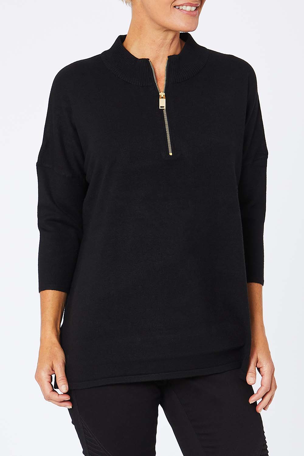 Model Amelia wearing the 3/4 Sleeve Zip Neck Jumper in colour Black (Black), from the front, cropped image