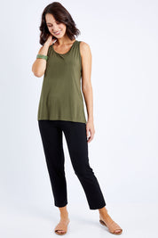 Model Andrea wearing size S of the Drape Bamboo Cami in colour Olive (Green), from the front, showing the whole outfit