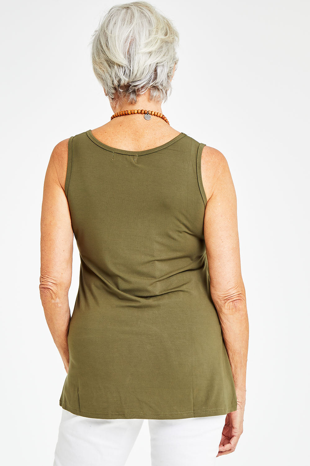 Model Elise wearing size S of the Drape Bamboo Cami in colour Olive (Green), from the back