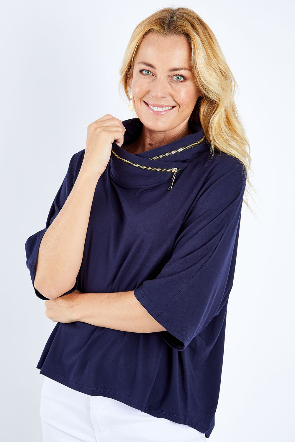 Model Bianca wearing size S of the Zip Neck Bat Wing Tunic in colour Dnavy (Blue), from the front, cropped image