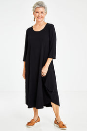 Model Elise wearing size S of the 3/4 Sleeve Bamboo Maxi Dress in colour Black (Black), from the front, showing the whole outfit