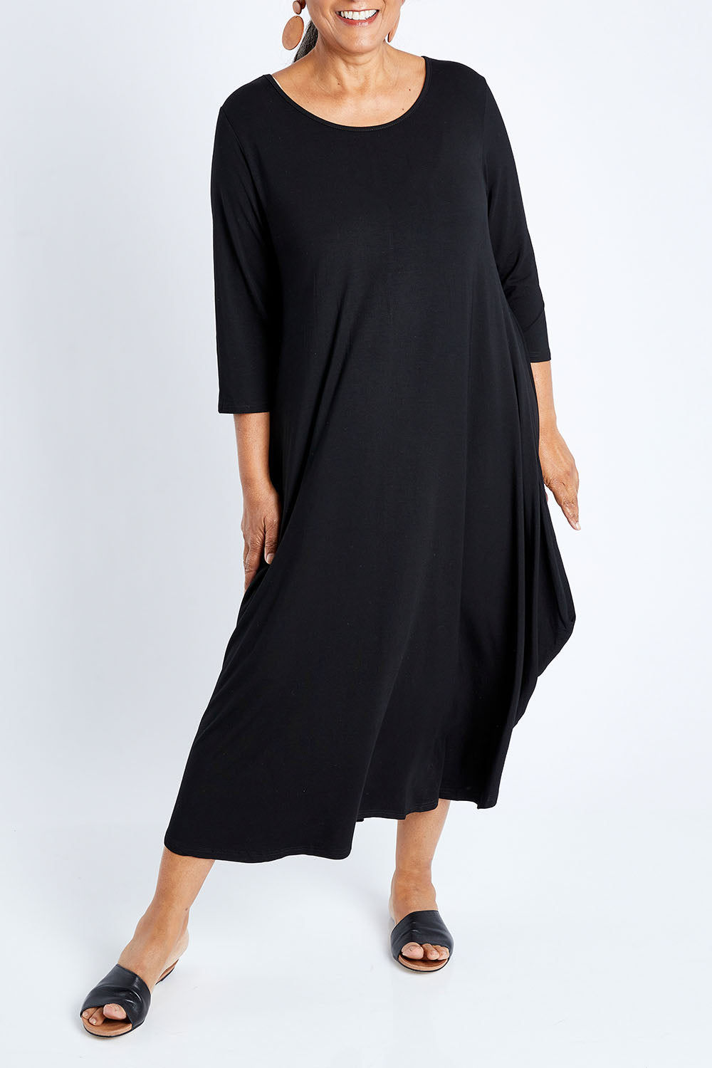 Model Nadine wearing size S of the 3/4 Sleeve Bamboo Maxi Dress in colour Black (Black), from the front, cropped image