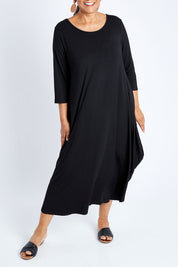 Model Nadine wearing size S of the 3/4 Sleeve Bamboo Maxi Dress in colour Black (Black), from the front, cropped image