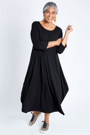 Model Nadine wearing size S of the 3/4 Sleeve Bamboo Maxi Dress in colour Black (Black), from the front, showing the whole outfit