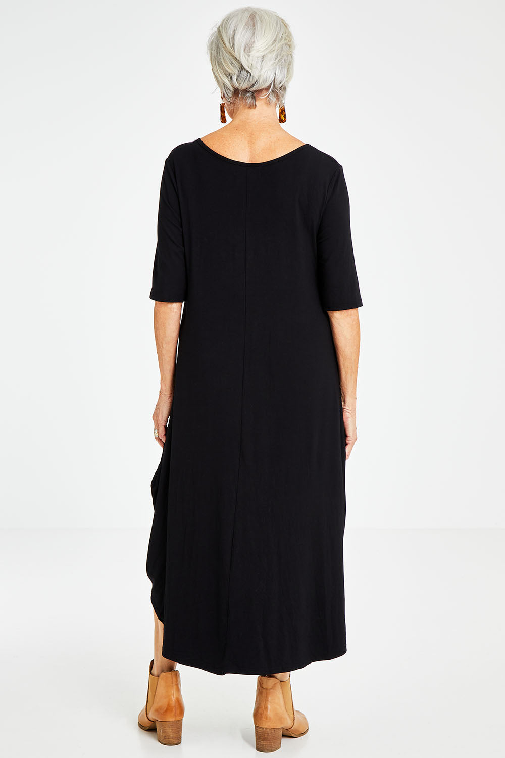 Model Elise wearing size S of the Half Sleeve Bamboo Maxi Dress in colour Black (Black), from the back