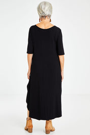 Model Elise wearing size S of the Half Sleeve Bamboo Maxi Dress in colour Black (Black), from the back