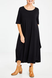 Model Elise wearing size S of the Half Sleeve Bamboo Maxi Dress in colour Black (Black), from the front, cropped image