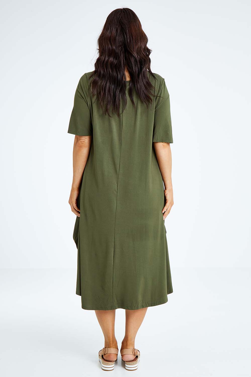 Model Laura wearing size L of the Half Sleeve Bamboo Maxi Dress in colour Olive (Green), from the back