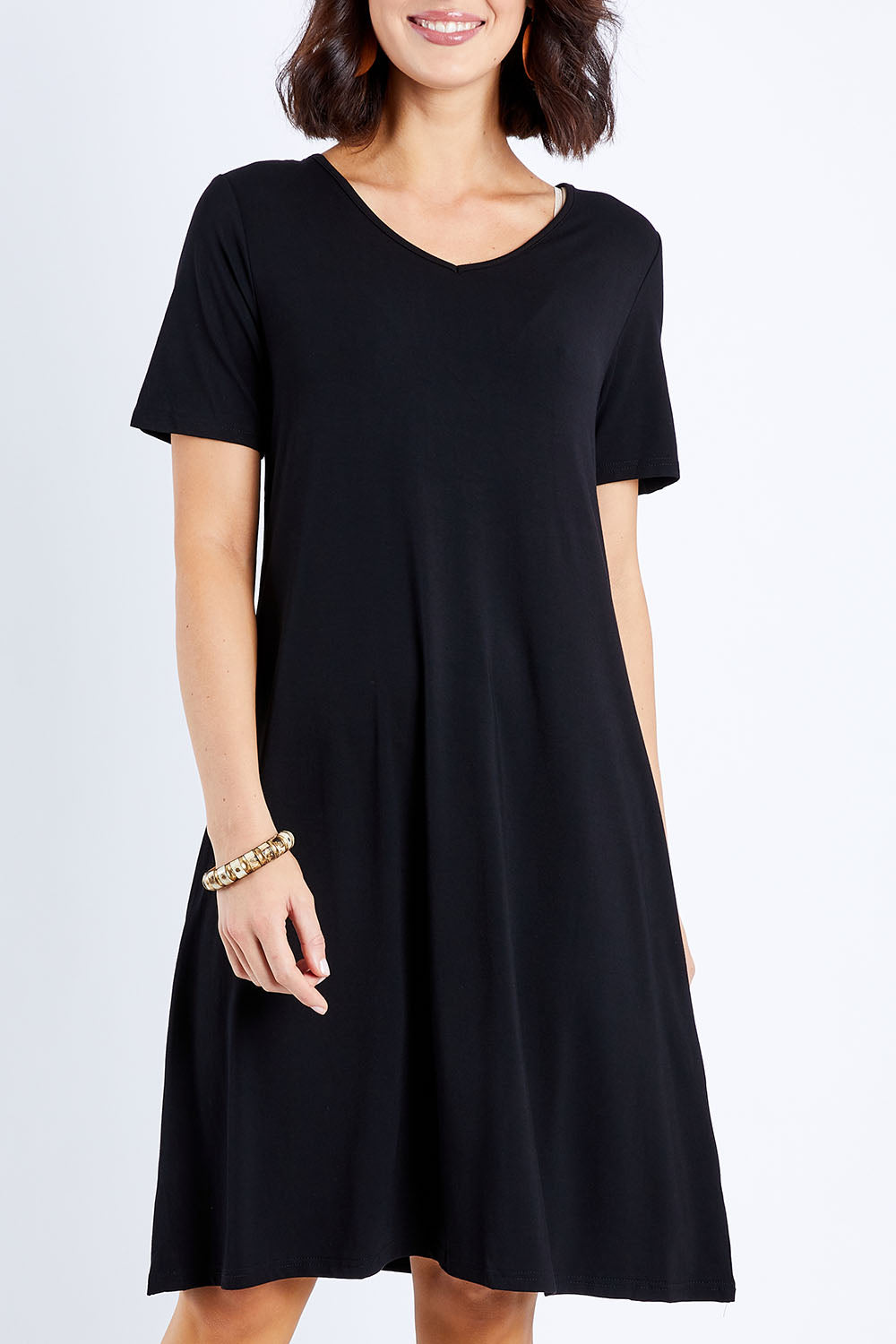 Model Andrea wearing size S of the Short Sleeve Vin colourNeck Bamboo Dress - Black (Black), from the front, cropped image