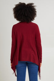 Model Olivia wearing size S of the Long Sleeve Knit Poncho in colour Burgundy (Red), from the back